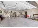 Spacious three car garage with painted walls, storage and bright lighting at 3104 Conners Dr, Las Vegas, NV 89107