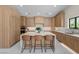 Contemporary kitchen featuring a center island with seating and abundant cabinet space at 3104 Conners Dr, Las Vegas, NV 89107