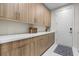 Laundry room featuring ample cabinetry, countertop space, and modern design at 3104 Conners Dr, Las Vegas, NV 89107