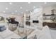 Elegant living room with a fireplace, piano, and comfortable seating at 3104 Conners Dr, Las Vegas, NV 89107