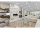 Cozy living room featuring a marble fireplace, plush seating, and modern decor at 3104 Conners Dr, Las Vegas, NV 89107
