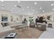 Spacious living room featuring a grand piano, neutral furniture, and bright, modern finishes at 3104 Conners Dr, Las Vegas, NV 89107