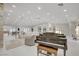 Bright, open-concept living area featuring a stylish piano, recessed lighting, and contemporary design at 3104 Conners Dr, Las Vegas, NV 89107