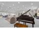 Bright, open living space features a grand piano and a comfortable seating arrangement at 3104 Conners Dr, Las Vegas, NV 89107