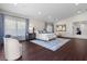 Large main bedroom featuring hardwood floors, sitting area, and neutral-toned decor at 3104 Conners Dr, Las Vegas, NV 89107