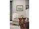 Cozy home office seating area with patterned chair, decorative table and ambient lighting fixture at 3104 Conners Dr, Las Vegas, NV 89107