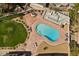 Aerial view of a sparkling swimming pool surrounded by a brick patio and outdoor seating at 3104 Conners Dr, Las Vegas, NV 89107