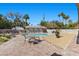 Backyard pool area featuring brick patio, inground pool, and outdoor seating at 3104 Conners Dr, Las Vegas, NV 89107