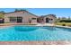 Beautiful pool surrounded by brickwork and lush landscaping at 3104 Conners Dr, Las Vegas, NV 89107