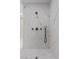 Elegant shower with marble tiling, modern fixtures, and glass enclosure at 3104 Conners Dr, Las Vegas, NV 89107