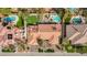 An aerial view highlights a tile roofed home with pool, manicured landscaping, and backyard amenities at 3236 Cliff Sieler Ct, Las Vegas, NV 89117