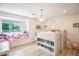 Bright bedroom with a built-in bed/bookshelf combo and window seat overlooking the front yard at 3236 Cliff Sieler Ct, Las Vegas, NV 89117