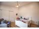 Cozy bedroom with superhero theme, white furniture, and closet at 3236 Cliff Sieler Ct, Las Vegas, NV 89117