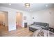 Playful bedroom showcasing a cozy gray couch, toys, and light wood flooring at 3236 Cliff Sieler Ct, Las Vegas, NV 89117