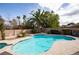Backyard boasts a sparkling pool with lush tropical landscaping at 3236 Cliff Sieler Ct, Las Vegas, NV 89117