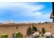 A cozy backyard space complete with desert landscaping and a brick perimeter wall at 348 Cadence Vista Dr, Henderson, NV 89011