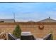 Enclosed backyard features hardscape and decorative objects. Brick wall enhances privacy at 348 Cadence Vista Dr, Henderson, NV 89011