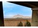 A block wall surrounds the property with views of the mountains in the distance at 348 Cadence Vista Dr, Henderson, NV 89011
