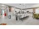 Spacious kitchen features an island with bar seating, granite countertops, stainless steel appliances, and white cabinets at 348 Cadence Vista Dr, Henderson, NV 89011