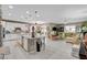 Open-concept living space featuring a modern kitchen with a large island and an inviting living room area at 348 Cadence Vista Dr, Henderson, NV 89011