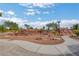 A landscaped playground features terraced rock landscaping with a playground area at 348 Cadence Vista Dr, Henderson, NV 89011