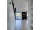 Living room with fireplace, staircase, and sliding door leading outside at 3484 Nightflower Ln # B, Las Vegas, NV 89121