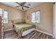 Cozy bedroom with a queen bed, a ceiling fan, and wood floors at 3486 Molinos Dr, Las Vegas, NV 89141