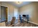 Bedroom features a gaming PC setup, wood floors, and neutral colored walls at 3486 Molinos Dr, Las Vegas, NV 89141