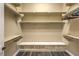 Walk-in closet featuring multiple shelves, hanging racks, and ample storage space at 3486 Molinos Dr, Las Vegas, NV 89141