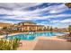 Beautiful community pool area with ample seating and a shaded pergola, ideal for relaxation and socializing at 3486 Molinos Dr, Las Vegas, NV 89141