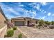 Beautiful single-story home featuring a tile roof, desert landscaping, and a spacious driveway at 3486 Molinos Dr, Las Vegas, NV 89141