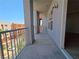 Balcony with railing offering an urban view of buildings and sky at 38 E Serene Ave # 432, Las Vegas, NV 89123