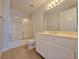 Bright bathroom featuring a shower and bathtub combination and white vanity at 38 E Serene Ave # 432, Las Vegas, NV 89123