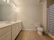 Well-lit bathroom with a double vanity and a toilet at 38 E Serene Ave # 432, Las Vegas, NV 89123