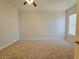 Empty bedroom with ceiling fan, neutral carpet, and a window with blinds at 38 E Serene Ave # 432, Las Vegas, NV 89123
