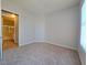 Carpeted bedroom with an ensuite bathroom and a window providing natural light at 38 E Serene Ave # 432, Las Vegas, NV 89123