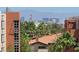 Distant city view surrounded by trees, rooftops, and buildings at 38 E Serene Ave # 432, Las Vegas, NV 89123