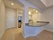 Welcoming entryway flows into a kitchen with a breakfast bar and stainless steel appliances at 38 E Serene Ave # 432, Las Vegas, NV 89123