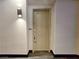 Condo entrance door with modern sconce lighting and unit number displayed at 38 E Serene Ave # 432, Las Vegas, NV 89123