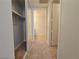 Hallway with access to closet and bathroom with light wood vinyl flooring at 38 E Serene Ave # 432, Las Vegas, NV 89123