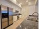 Well-lit kitchen with stainless steel appliances, granite countertop, and modern white cabinets at 38 E Serene Ave # 432, Las Vegas, NV 89123