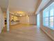 Spacious living room featuring light wood floors and large windows providing ample natural light at 38 E Serene Ave # 432, Las Vegas, NV 89123