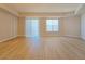 Bright, open living area with laminate floors, natural light from windows and sliding door at 38 E Serene Ave # 432, Las Vegas, NV 89123