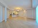 Spacious open-concept living area with recessed lighting, adjacent kitchen, and laminate flooring at 38 E Serene Ave # 432, Las Vegas, NV 89123