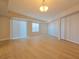 Bright living space featuring laminate floors, natural light, and a sliding glass door to the balcony at 38 E Serene Ave # 432, Las Vegas, NV 89123