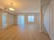 Bright living space featuring laminate floors, natural light, and a sliding glass door to the balcony at 38 E Serene Ave # 432, Las Vegas, NV 89123