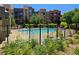 Community pool is fenced with plenty of green space for relaxing and enjoying the outdoors at 38 E Serene Ave # 432, Las Vegas, NV 89123