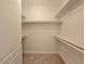 Bright walk-in closet with built-in shelving and ample storage space at 38 E Serene Ave # 432, Las Vegas, NV 89123