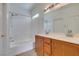 A bright bathroom with double sinks, modern fixtures, and a shower-tub combination at 3920 Smokey Fog Ave # 201, North Las Vegas, NV 89081