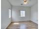 An empty bedroom offering beautiful floors, windows, and a ceiling fan at 3920 Smokey Fog Ave # 201, North Las Vegas, NV 89081
